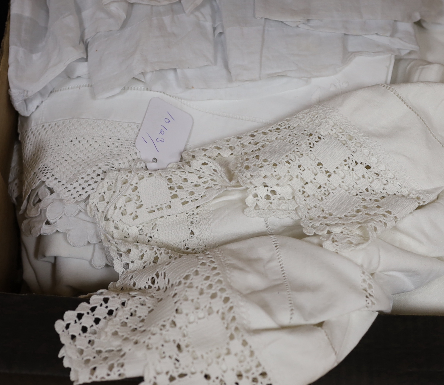 A 19th century white worked and hand made lace christening gown with a collection of table linens and a collection of coloured embroidered linens and a child's dress (2 boxes)